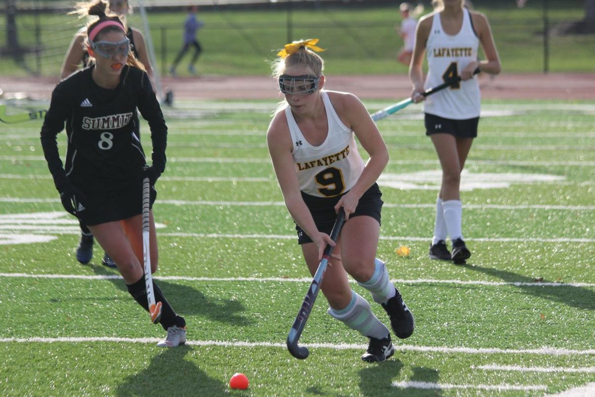 During the Oct. 15 field hockey game against Rockwood Summit, senior Lilly Balderson pushes the ball down the field. The Lady Lancers fell to the Falcons 1-2, but they ended the regular season with a 12-8 record. The Lady Lancers' next game is on Oct. 30 against MICDS where the girls will attempt to advance to the Final Four of the State Tournament.
