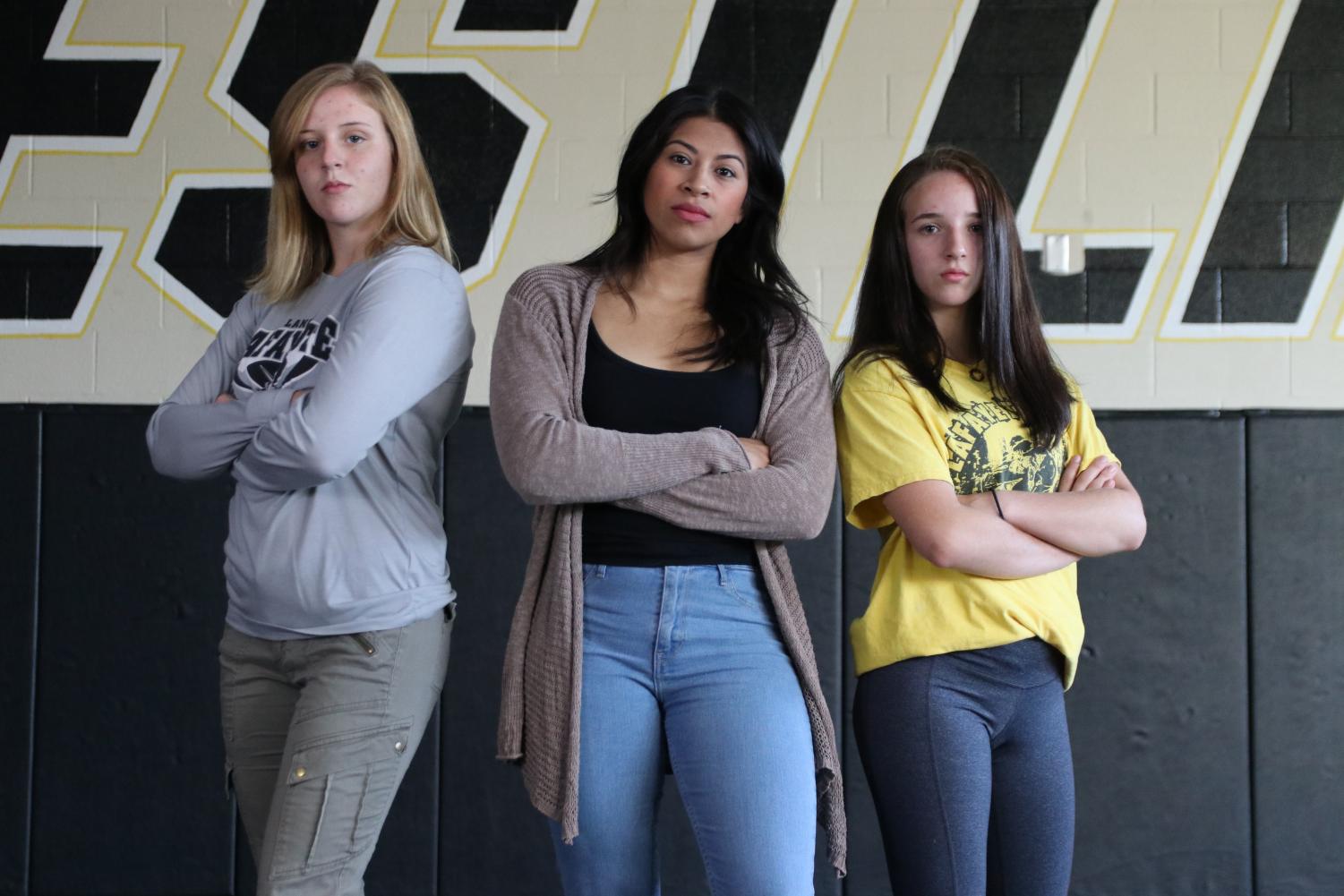 Junior Emma Cole, Head Coach Berenice Blanco and freshman Faith Cole will be leading the girls wrestling team in their first season as a state sponsored team.