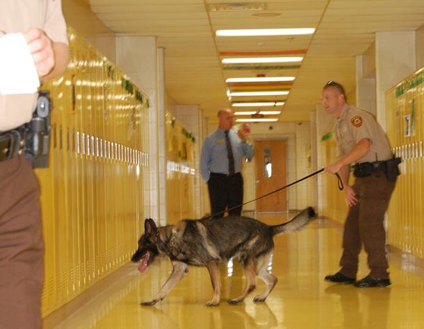 Drug dogs search lockers, parking lot