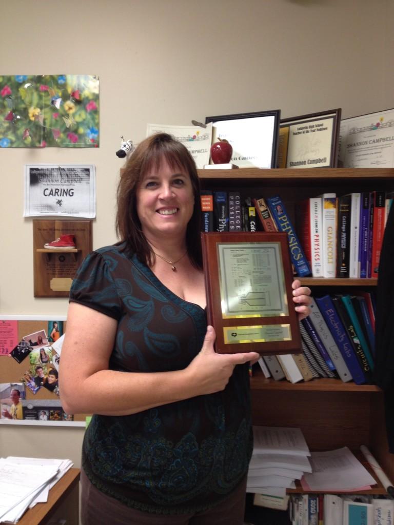 Campbell with a plaque she received for one of her patents