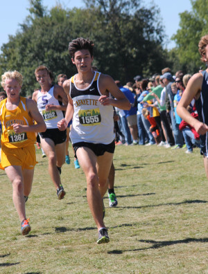 Senior Alec Haines competes in a cross country meet. Haines placed  third in this meet. 