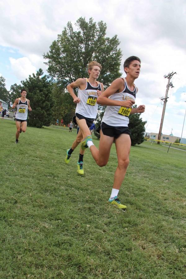 Seniors Alec Haines and Devin Meyrer and Junior Austin Hindman compete in the Forest Park Invitational