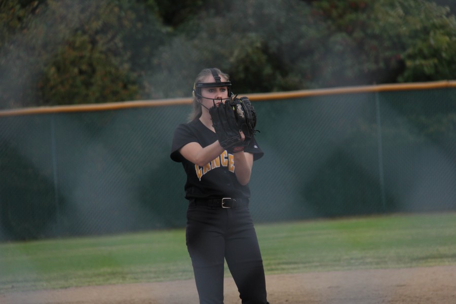 Starting pitcher, Mackenzie Myers, waits for the pitch signal from catcher, Hannah Gessner, against Rolla. Lafayette won this District game 4-1.