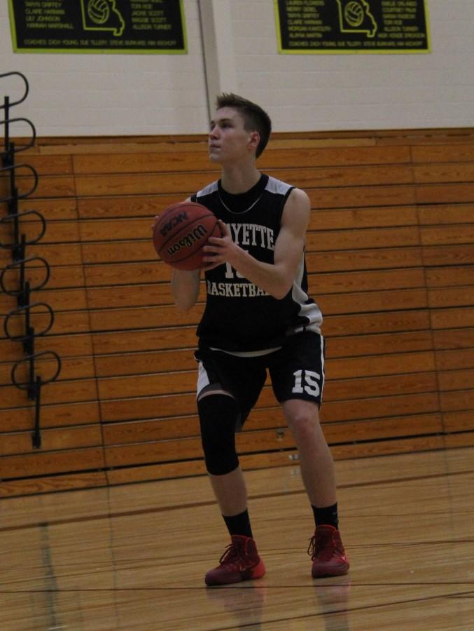 Forward+Luke+Finley+practices+his+free-throws+in+the+main+gym+at+practice.+Finley+scored+a+total+of++50+points+in+three+games+in+the+Hall+of+Fame+Classic+High+School+basketball+tournament.