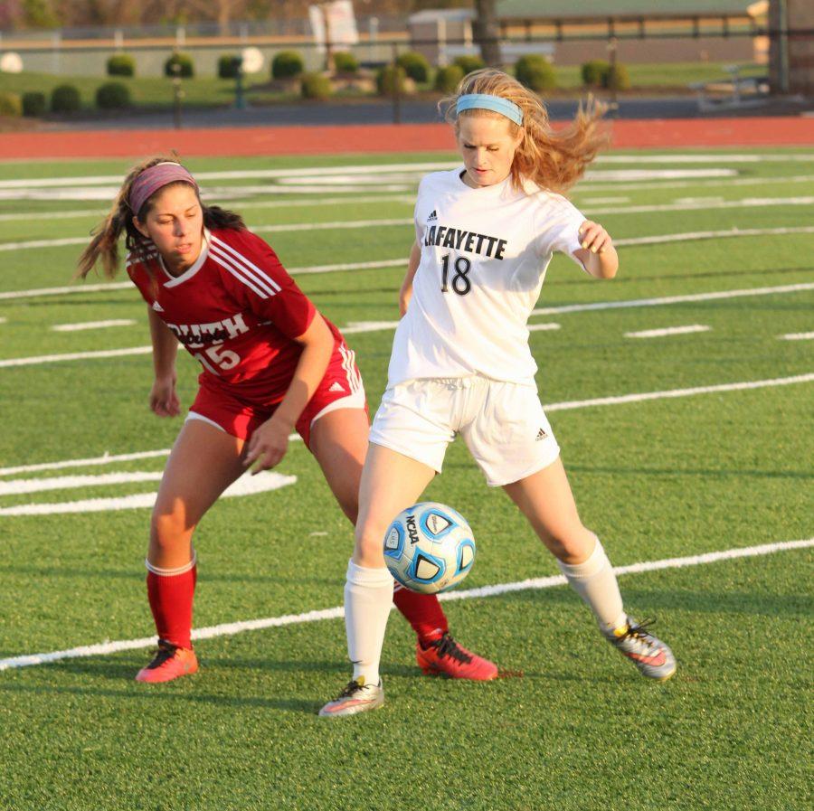 Jessica Smith (18) takes control of the ball in a game against Parkway South.
