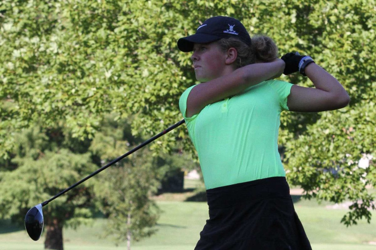 Judging her shot carefully, senior Paige Sanfelippo swings her driver. Sanfelippo has one of the lowest 18-hole scores in the St. Louis area with 71 strokes.