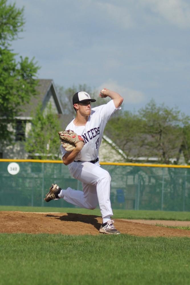Stepping forward, Jack Riney throws a pitch to the Seckman batter. “We all love to get on the field and compete. The atmosphere is always very relaxed which is a big key to our success,” Riney said.