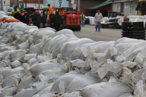 Sandbags form a wall in front of businesses in Downtown Eureka after hours of work by volunteers.