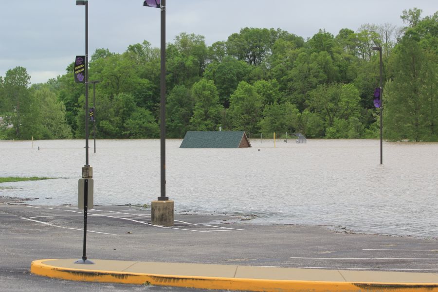 Water invades the parking lot of Eureka High School leaving the concession stand under water. 