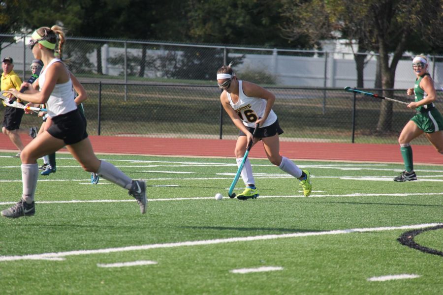 Looking towards the goal, freshman Mia Simpson runs down the field. Simpson has 15 goals and 11 assists on the season. 