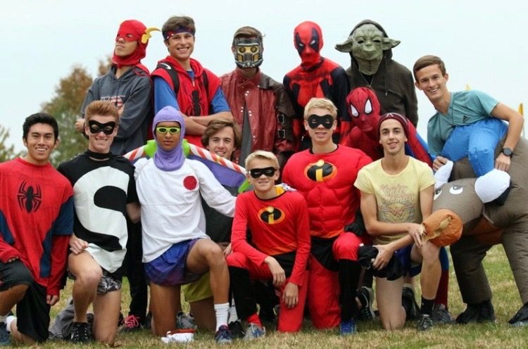 Taking a break from running and previewing the State Meet course, the boys cross country team pose in their superhero costumes. In an attempt to keep things light and have fun before the State Meet race, the team dressed up in their costumes on the Friday before their Saturday morning competition.