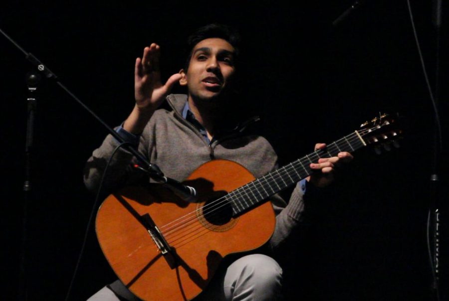 Performing a skit with Rohan Bohra, Mr. Philosophy Club, at the 2018 Mr. LHS show on Feb. 23, Rithik Reddy, Mr. Speech & Debate, plays the guitar as he entertains the audience.