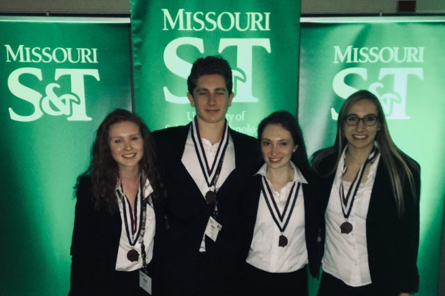 Junior Grace Rook, junior Dylan Kutun, sophomore Katie Tremper and sophomore Audrey Krone receive third place medals for their creation of a public service announcement about Prediabetes