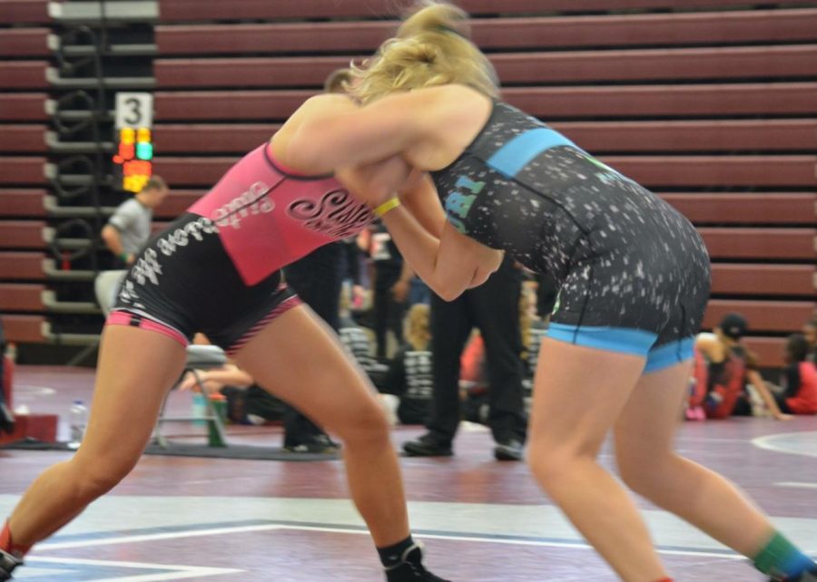 Sophomore Emma Cole (right) competing in a wrestling match with her Missouri National Team. Cole will use the skills shes learned with the Missouri National Team to lead the new girls wrestling team next school year. 