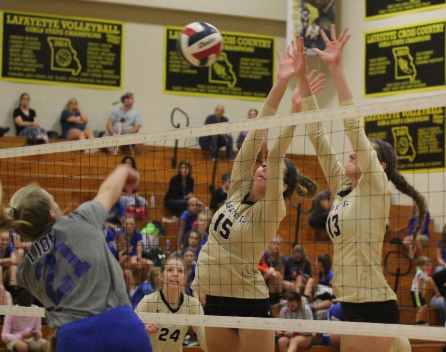 During a game against Northwest, juniors Allison Beaton and Fiona Lazzaretti attempt to block a hit. The Lady Lancers went on to win the match and the game in two sets. Beaton ended the game with two blocks and three kills. 