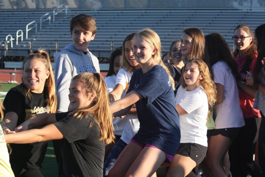 During the junior versus sophomore tug-of-war game, the sophomore class tries to muscle the rope towards them. The sophomores lost the game to the juniors, but the juniors went on to fall to the senior class.