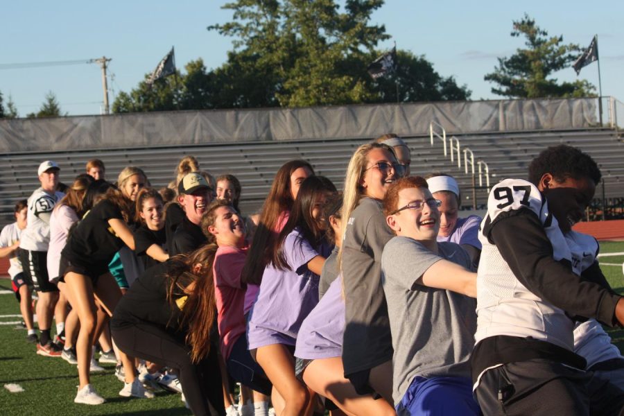 During the junior versus sophomore tug-of-war game at the Homecoming kickoff on Sept. 23, the junior class attempts to pull the rope to their side of the football field and defeat the sophomores.