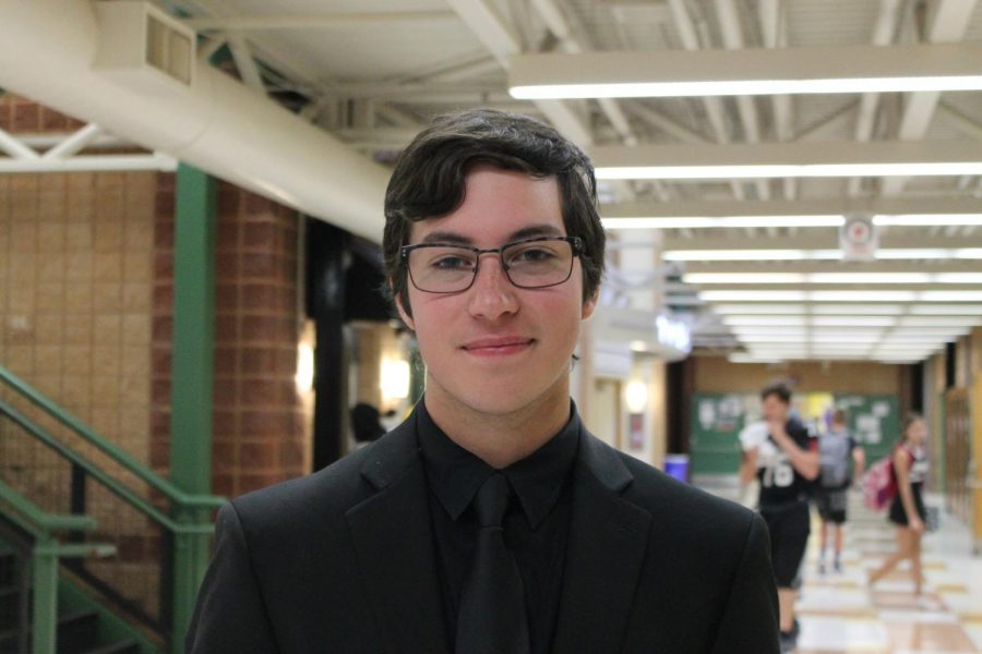 Dressed+in+his+Jazz+Band+concert+attire%2C+senior+Noah+Korenfeld+performs+the+trombone+during+lunch+on+the+Friday+of+Homecoming.