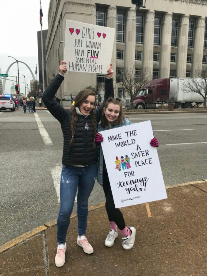 Seniors Melina Hudak and Kendell Oelschlaeger march in downtown St. Louis at the Womens March.