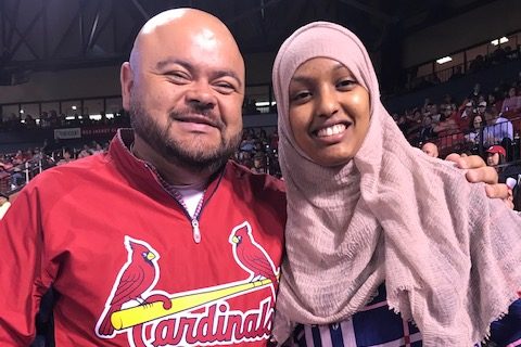 Polo Ascencio, Spanish broadcaster for the St. Louis Cardinals and Sumaya Sheikh , ESOL student attend a Cardinals game.