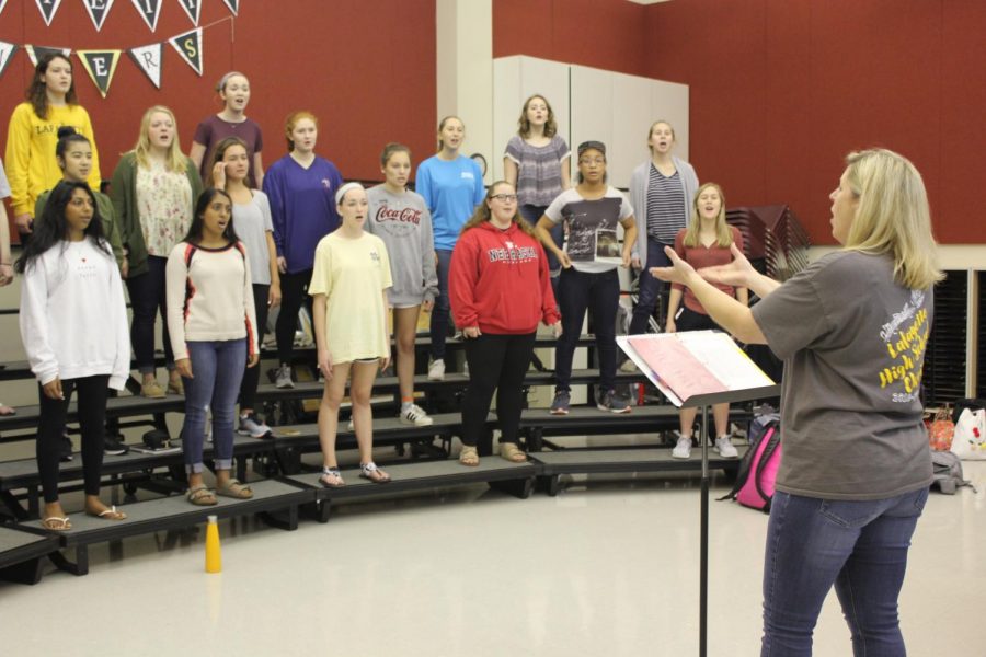 During 4th hour, choir teacher Christy Shaffer directs the Treble Chamber choir as they sing the song This is Me.