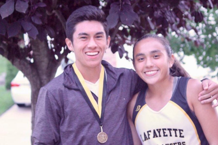 After a cross country race during the 2016-2017 season, Kayla and her brother, Cameron, celebrate the successful race. Kayla and Cameron ran cross country together while they were both at LHS. 