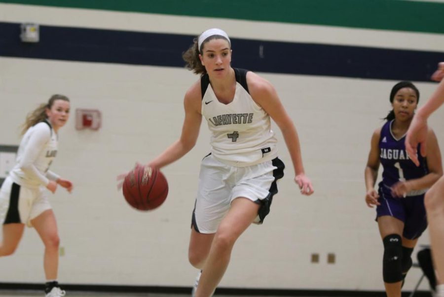 Initiating+a+fast+break%2C+senior+Tara+Robbe+dribbles+down+the+court+during+a+Nov.+30+game+against+Fort+Zumwalt+West.+Despite+the+Lady+Lancers+38-29+loss%2C+Robbe+was+named+to+the+All-Tournament+Team+along+with+junior+Madison+Chester.+