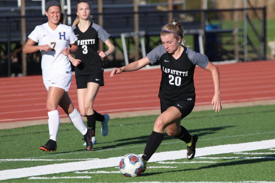 Rylee Howard pushes past the Francis Howell defense in order to move the ball down into the attacking area. The Lancers beat Howell 3-1 on April 8. 