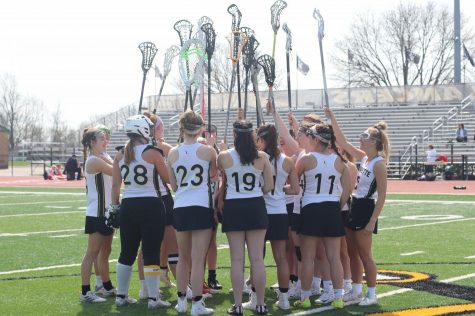 After winning the Wildwood Tournament (2019), the girls lacrosse team huddles in the middle of the field to celebrate. Halfway through the season, the Lady Lancers remain undefeated with a 12-0 record. 