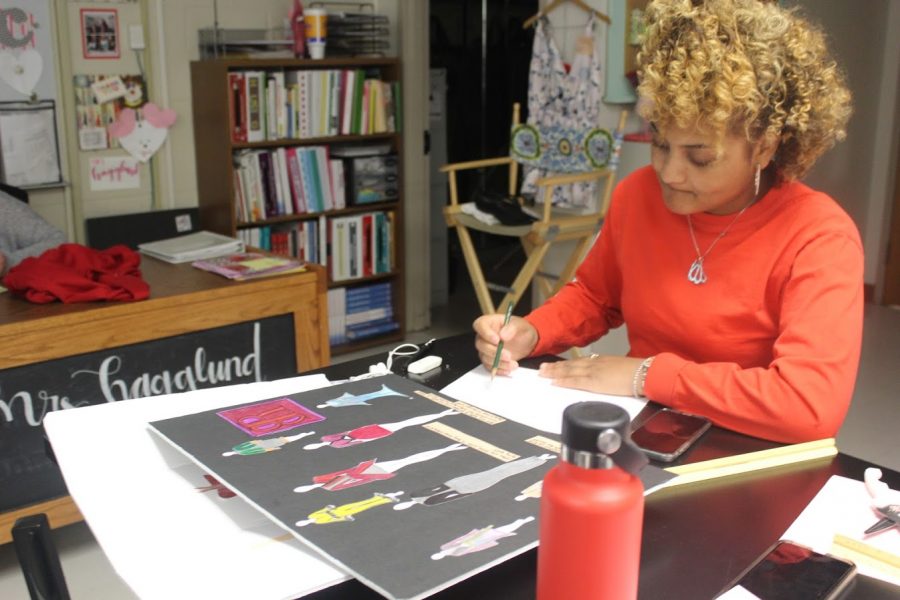 Junior Lauren Liggins works on her clothing designs during 4th hour Fashion Design and Merchandising. 