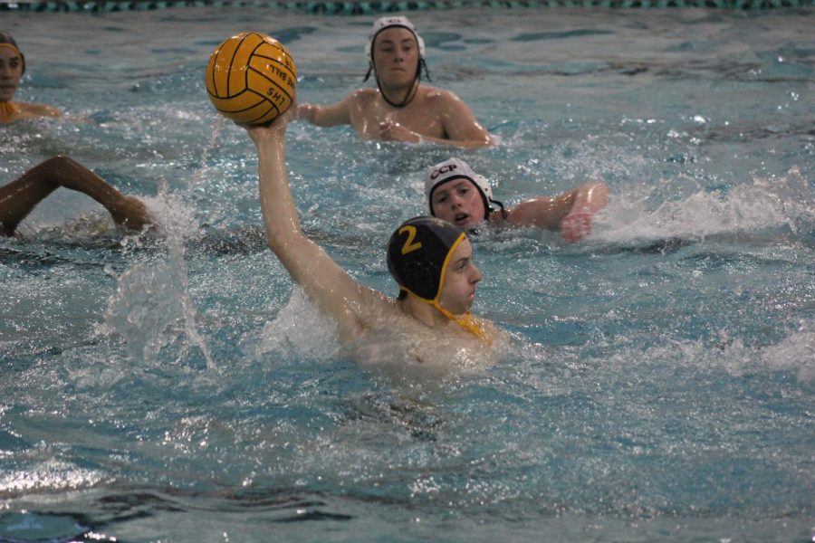 In a game against Chaminade, freshman Dylan Vorbeck looks down the pool to throw. 