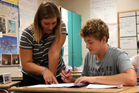 With a quiz later in the day, Matthew Haefner, freshman, studies with math teacher Katrina Clark.