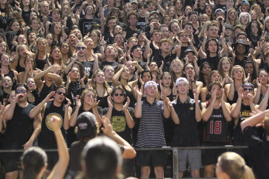 Lafayettes student section cheers at a home game during Friday Night Lights. The theme of the night was black out.