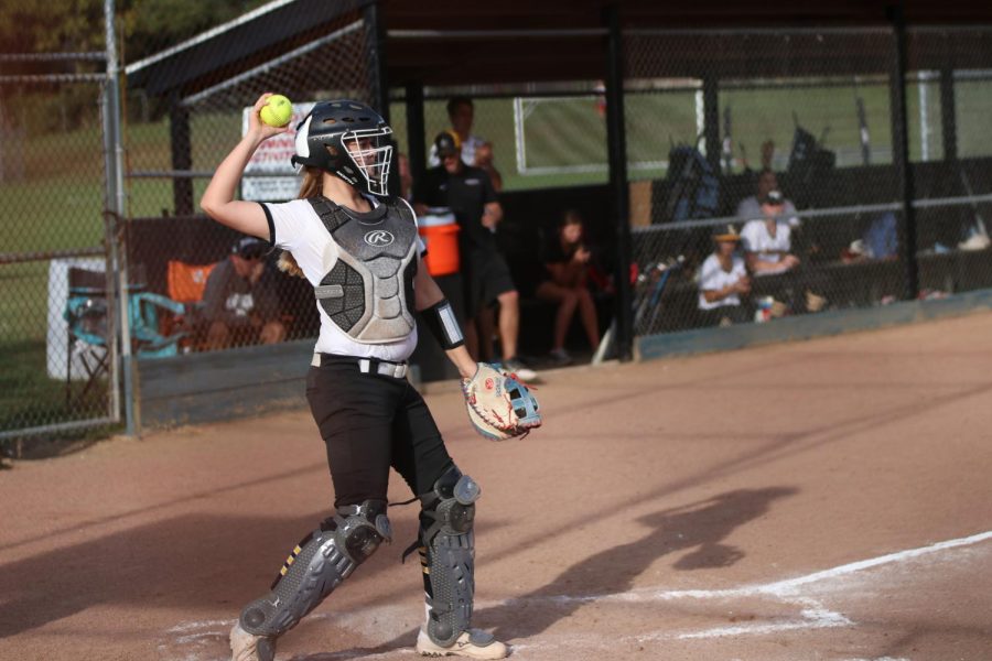 Catcher Kathryn Flowers throws the ball back to the pitcher during Lafayettes game against Lindbergh. 