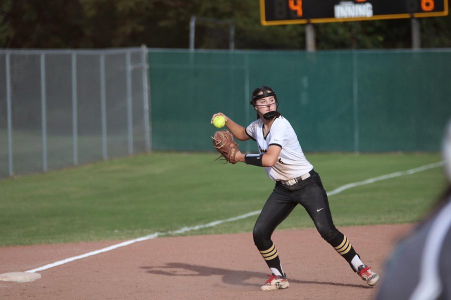 Infielder Kaley Adzick gets ready to make a throw to record an out. 