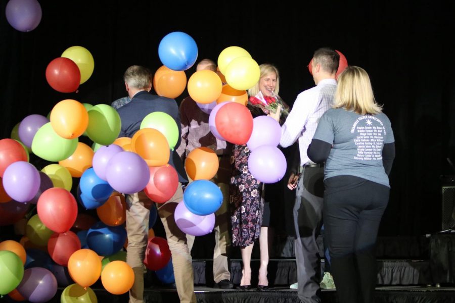 As balloons fall from the rafters, Librarian Nichole Ballard-Long is recognized at the Academic Pep Assembly on March 12, 2019 for being named the 2018-2019 Teacher of the Year.