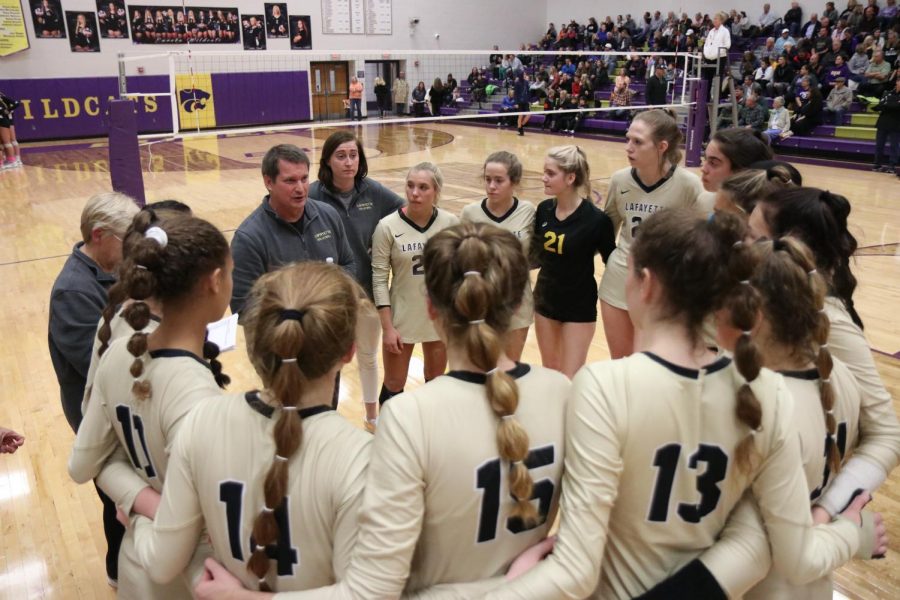 During a timeout in the District championship against the Eureka Wildcats on Oct. 30, Head Coach Zachary Young talks to his team. The Lancers won in two sets, and went on to beat Oakville and Cor Jesu on Nov. 2.