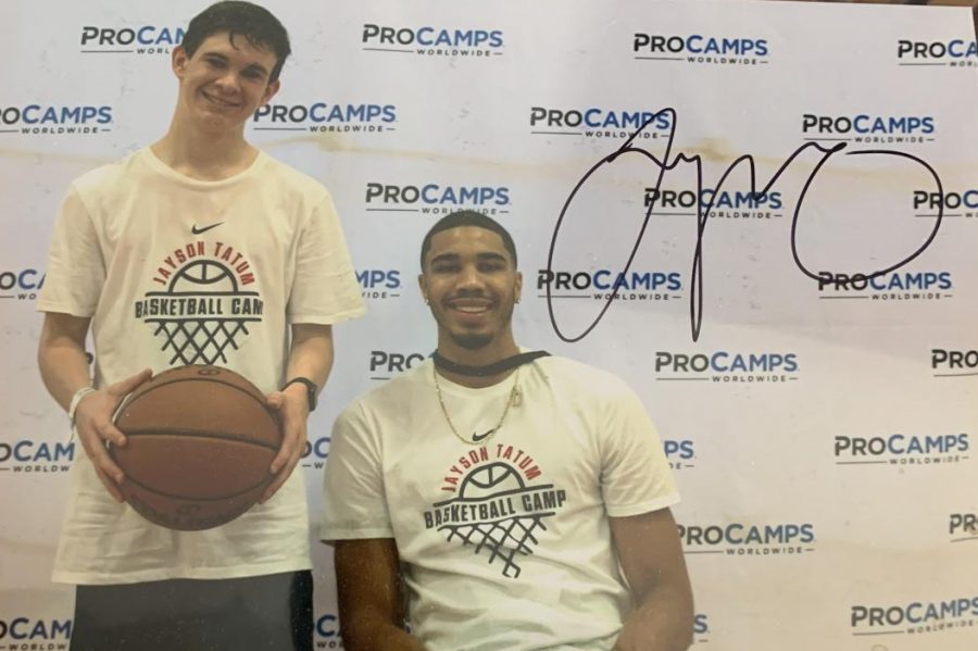 Sophmore Tom Richards poses with NBA star and St. Louis native Jayson Tatum. I met Tatum through a basketball camp I attended with my friend, said Richards. 