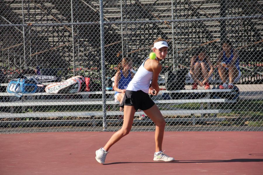In a match against Ladue in 2018, Katie Ferguson prepares to hit the ball back to her opponent. 