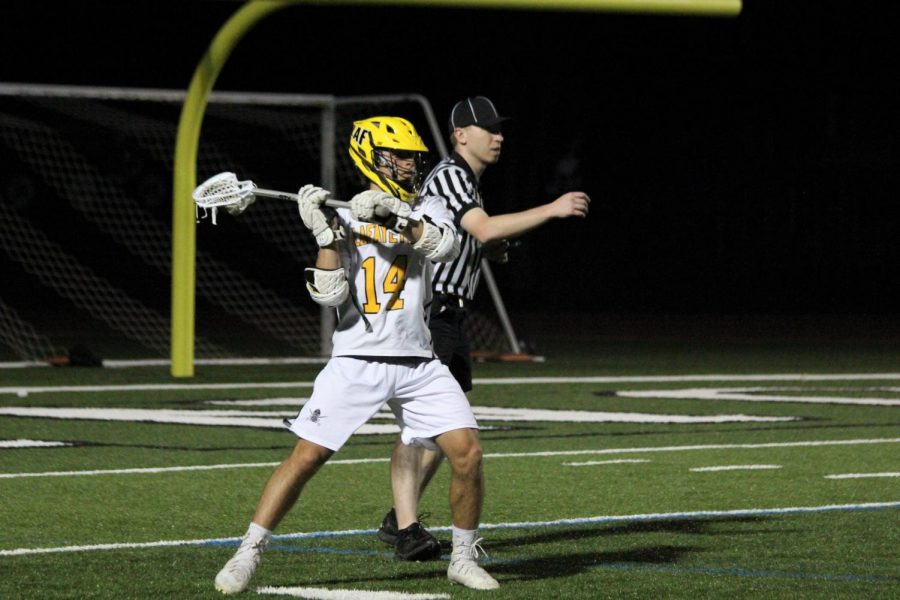 At the game against Marquette, Senior Braeden Williams prepares to throw the ball downfield. 