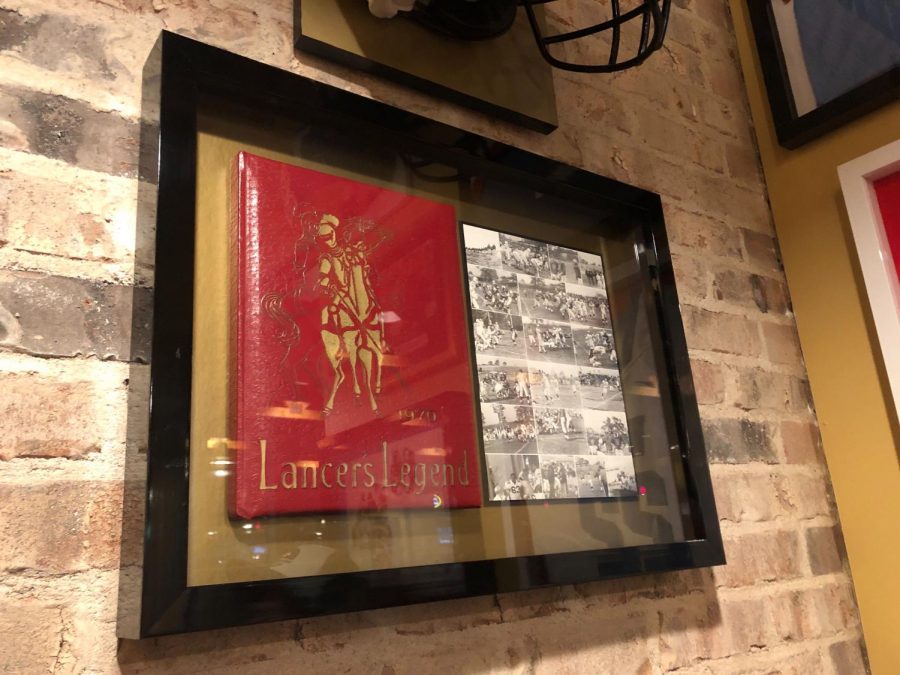 At Canes in Ellisville, Lafayette High Schools 1970 yearbook is displayed in a show box on the wall. The page open is sports- all the photos are black and white and the cover is a thick red hard cover. Next time you are craving some Canes chicken make sure to check out the old yearbook.