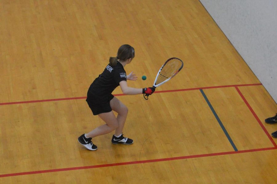 Sophomore Hannah Werk serves a ball in a duos match in 2019s National racquetball tournament.