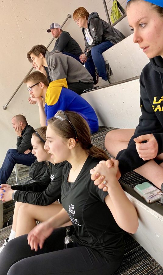 Fellow athletes show support coming together to root for their teammates during final matches of the evening. There were times I was there from 8:30 a.m. to 10 at night, sophomore Maggie Leath said.