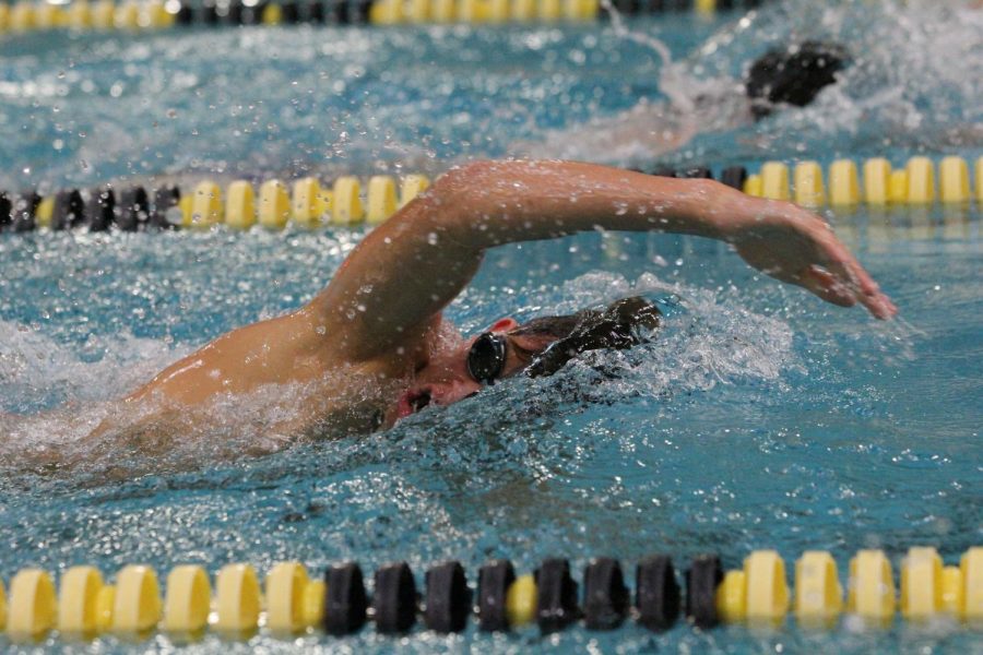 Freshman Caleb Warner digs in to his stroke during a boys swimming and diving team practice. Starting Sept. 14, sports that were classified as low-contact were allowed to participate in games or meets. The boys swimming and diving team is one of them, and they won their first meet against Wentzville Liberty, 138-45.