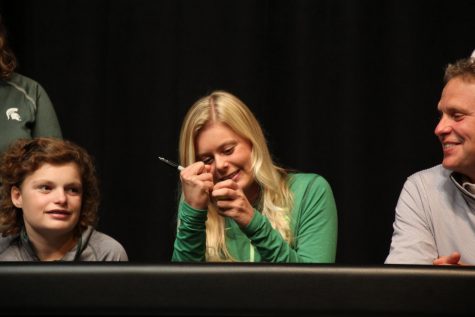Senior Brooke Biermann signs a gold ball after signing her letter of intent for Michigan State University for girls golf. Over her Lafayette career, Biermann has medaled at State four times. In her freshman year she placed fourth, in her sophomore year she placed second, in her junior year she placed first and this year, she placed second.