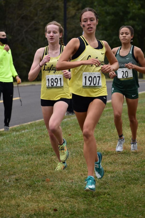 At the Parkway West Dale Shepard Invitational, senior Hope Ware and Elissa Barnard run the course side by side. The Lancers won the invitational, and Ware placed fourth, Barnard placed sixth.
