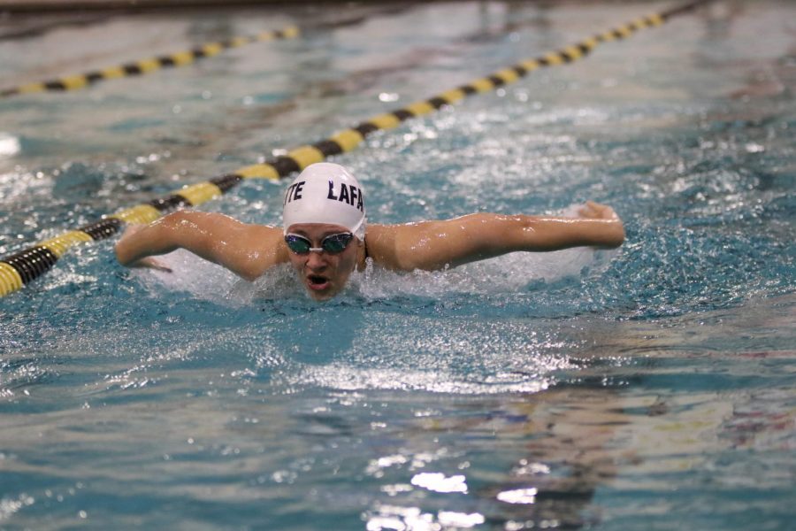 In a match against Eureka in January 2020, junior Lindsey Lohr competes in a swim meet against Eureka High School. Girls swimming and diving is the only low frequency contact winter sport, and players are required to wear their mask unless they are swimming in the pool.