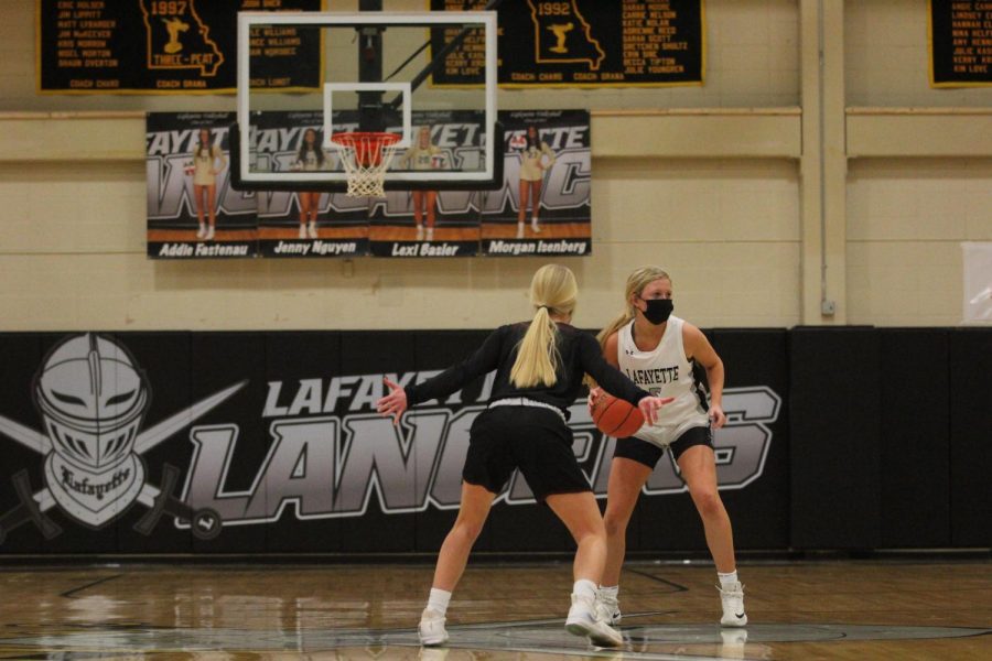 On Nov. 23, senior Brynn Jefferies takes the ball down the court against Rockwood Summit. Jefferies lead the team in scoring, having 14 points to propel the team to victory. The Lancers won the game 55-31 and began the season with a win.