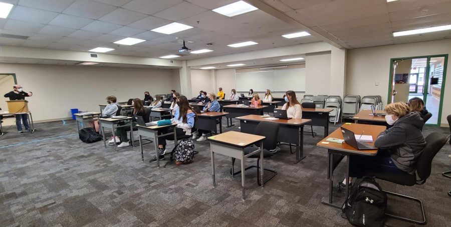 Jeffery Landow teaches his 6th hour Language arts class in a larger room than usual to accomodate for him being immunocompromised.