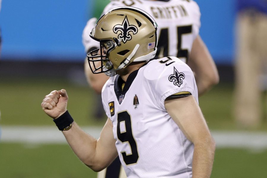 Quarterback Drew Brees (9) of the New Orleans Saints reacts after throwing a touchdown pass during the second half of their game against the Carolina Panthers at Bank of America Stadium on January 03, 2021 in Charlotte, North Carolina. (Jared C. Tilton/Getty Images/TNS)
